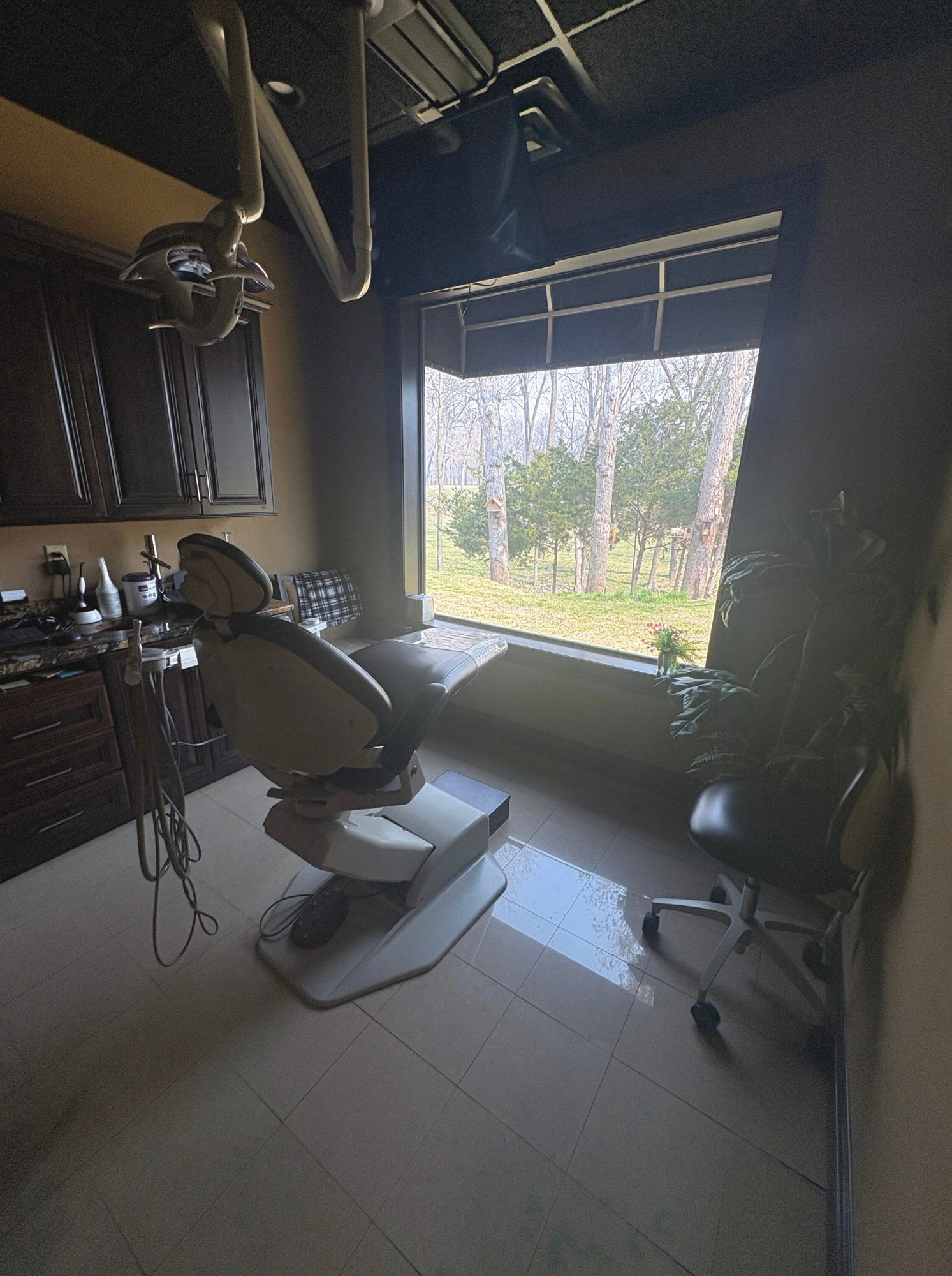 Treatment room window overlooking the trees near Grand Lake